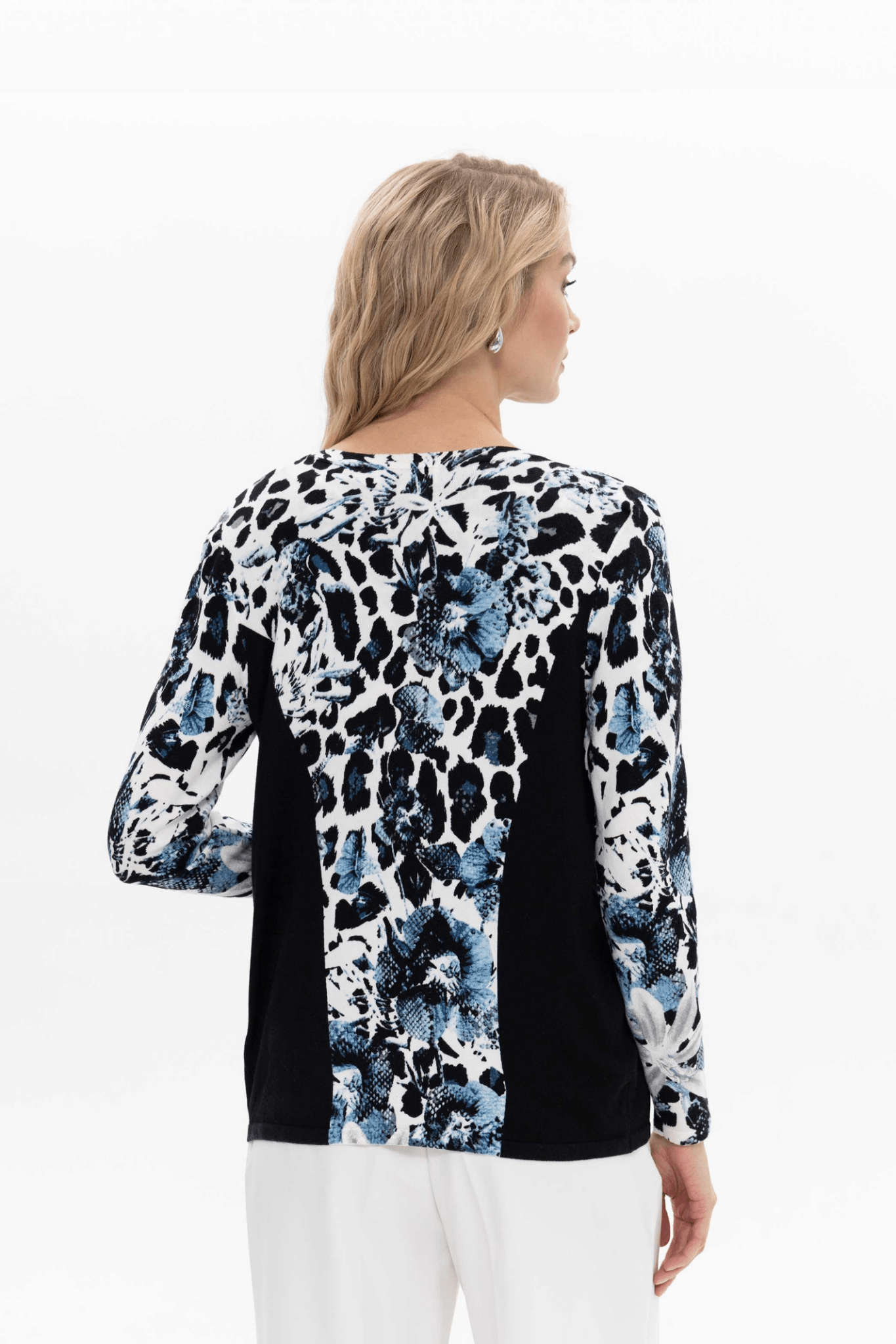 Passioni twinset. Featuring a striking jean blue leopard print, this top and cardigan set creates a coordinated look with minimal effort. Available at Dotique