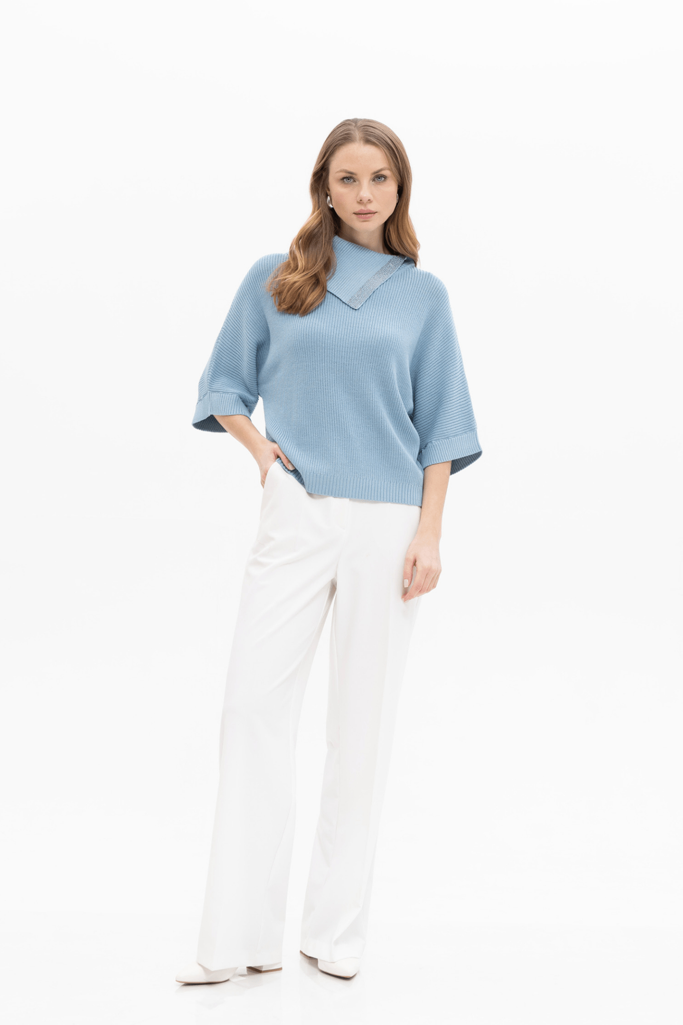 Passioni 18252 Blue High Neck Jumper. Featuring a stylish fold-over high neckline with subtle sparkle trim, this jumper is crafted from a comfortable blend of 65% viscose, 20% polyamide, and 15% polyester.
