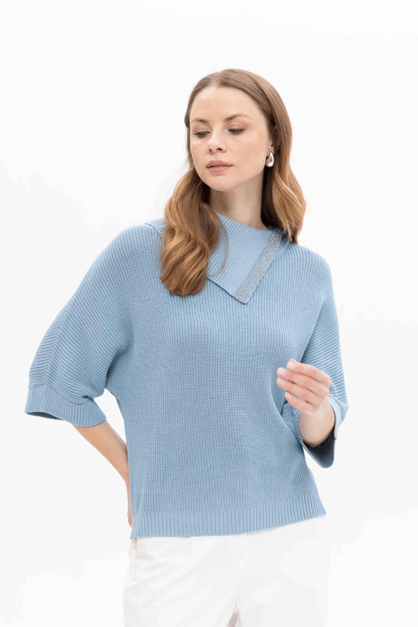 Passioni 18252 Blue High Neck Jumper. Featuring a stylish fold-over high neckline with subtle sparkle trim, this jumper is crafted from a comfortable blend of 65% viscose, 20% polyamide, and 15% polyester.