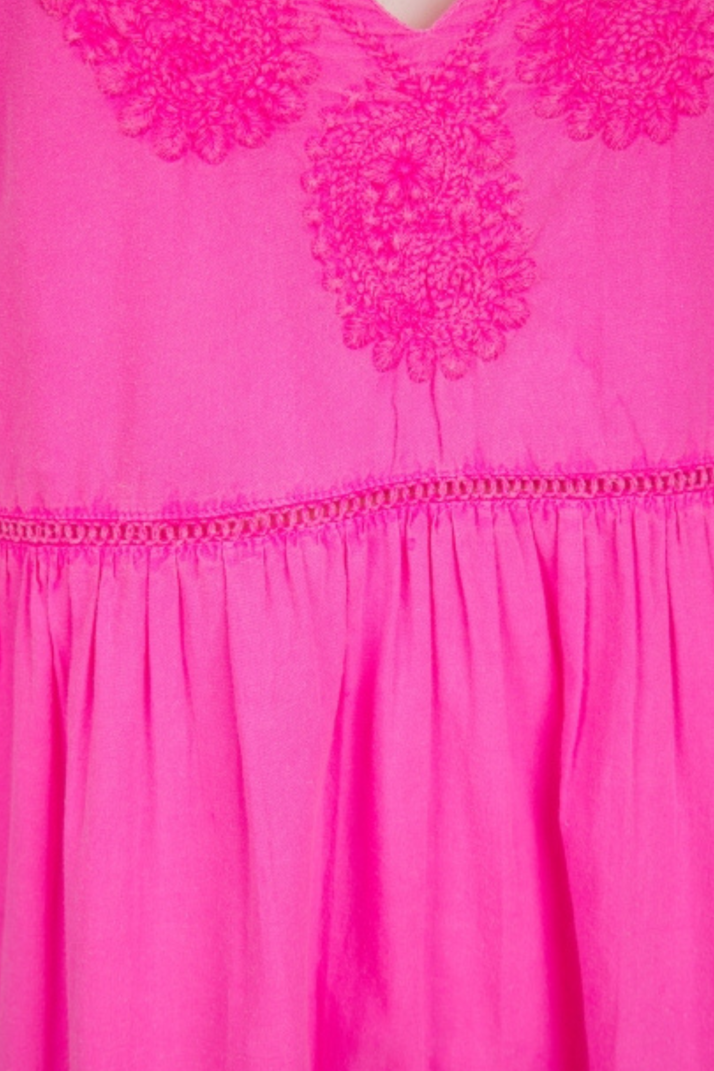 Bright neon fuchsia mini dress with embroidered balloon sleeves and a flattering V-neck. Easy, throw-on style with beautiful movement. Shop at Dotique.