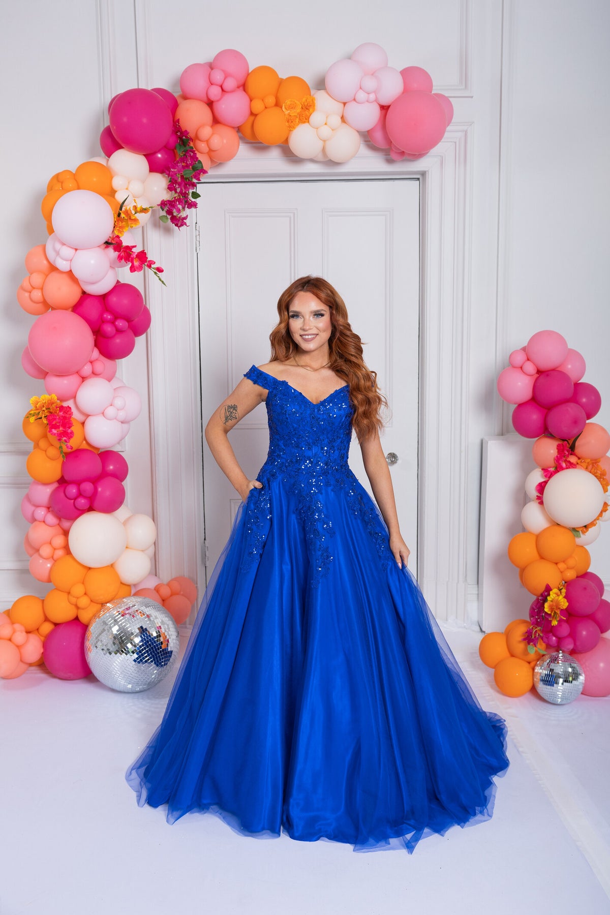 Prom Frocks PF1002 in Royal Blue, sequinned Bardot ballgown. Shop Prom Frocks at Dotique.