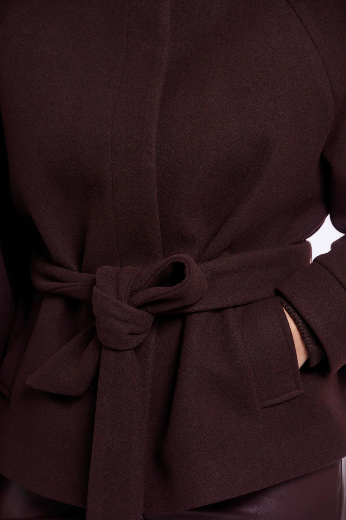 Shop the Rino & Pelle Cornelia Jacket in Chocolate Bean at Dotique. A soft dark brown belted jacket with a button front and side pockets.
