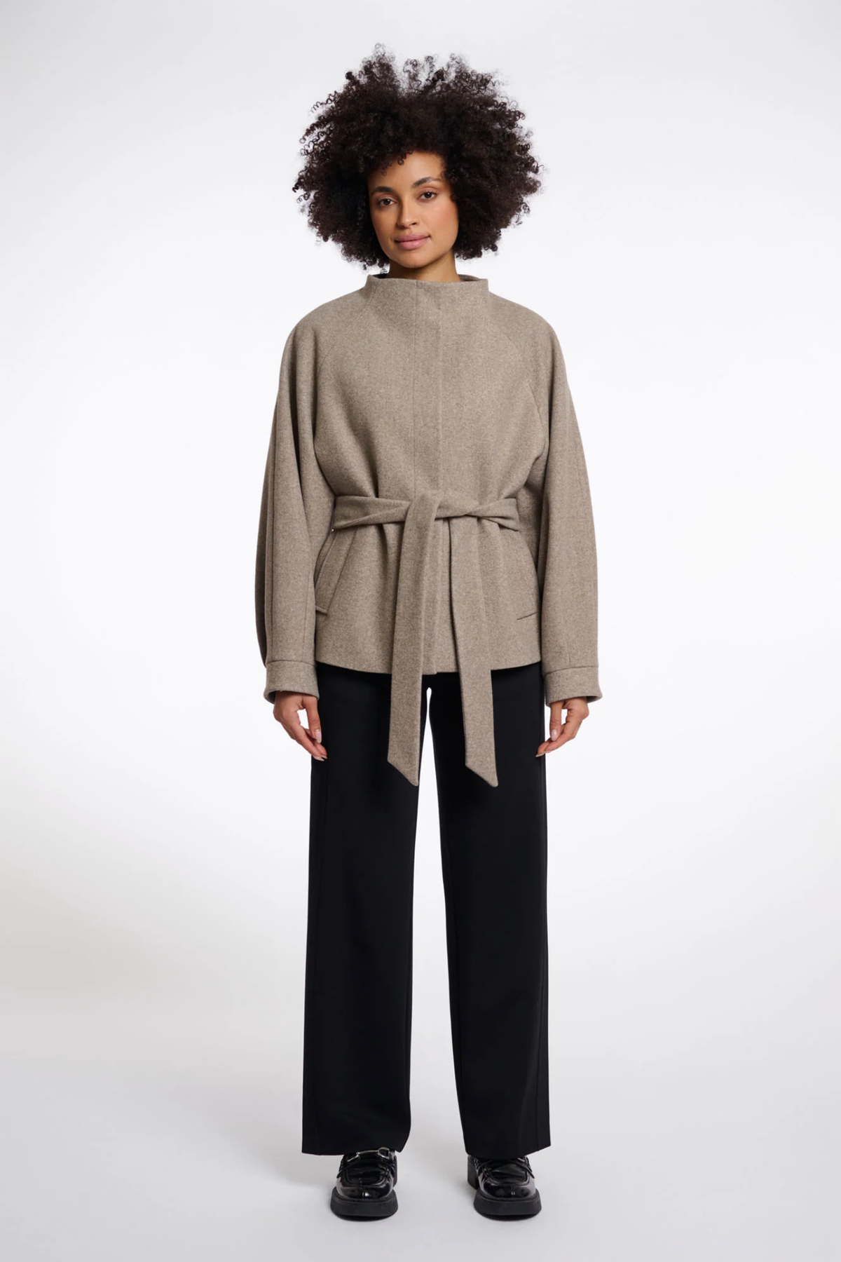 Shop the Rino & Pelle Cornelia Jacket in Toffee Melange at Dotique. A soft lightweight jacket with a belted waist, button front and side pockets.