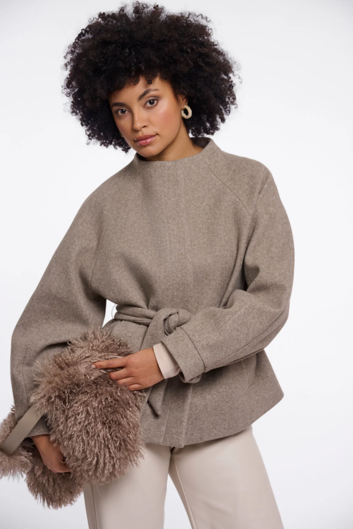 Shop the Rino & Pelle Cornelia Jacket in Toffee Melange at Dotique. A soft lightweight jacket with a belted waist, button front and side pockets.