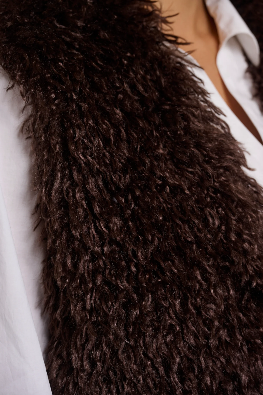 Shop the Rino & Pelle Sensy Faux Fur Waistcoat in Coffee Roast at Dotique. A soft brown faux fur gilet with a relaxed fit, perfect for autumn layering.