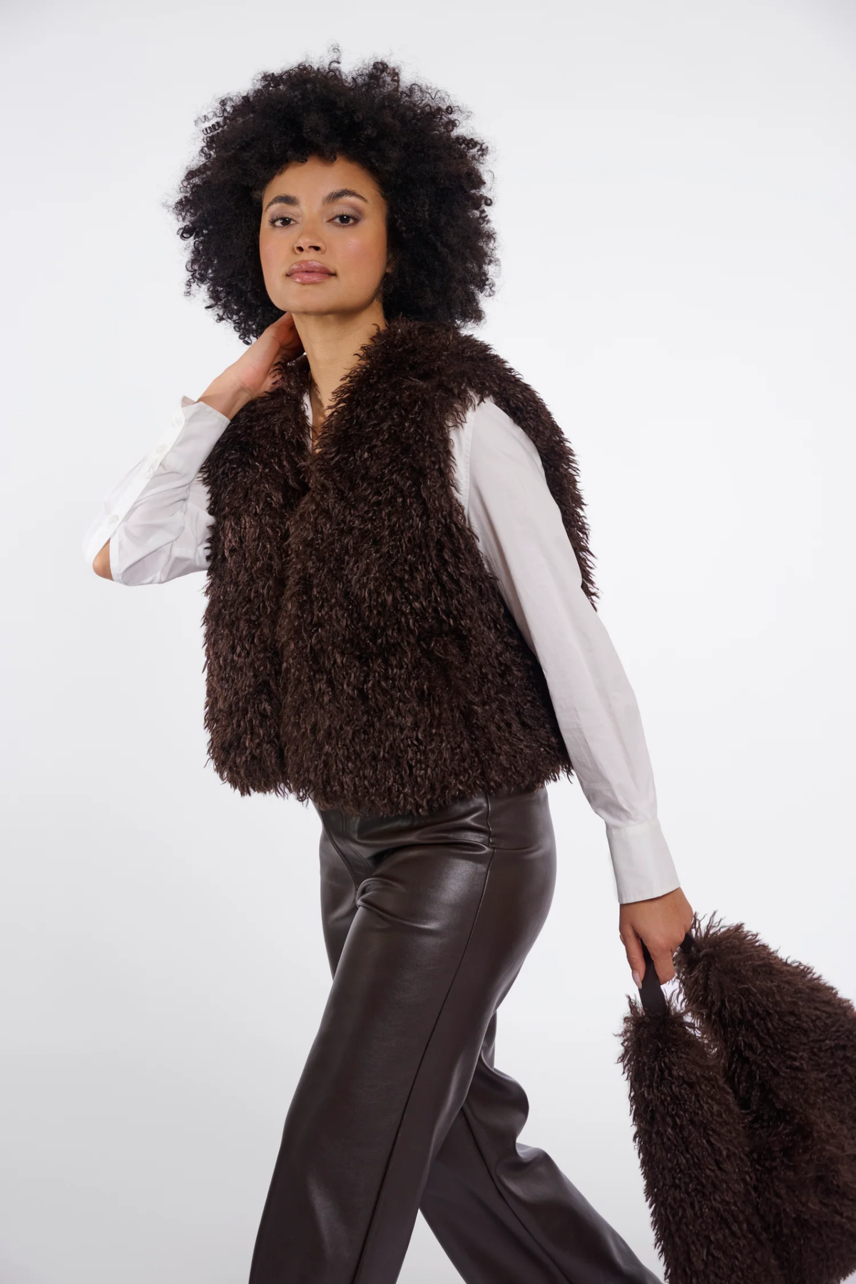 Shop the Rino & Pelle Sensy Faux Fur Waistcoat in Coffee Roast at Dotique. A soft brown faux fur gilet with a relaxed fit, perfect for autumn layering.