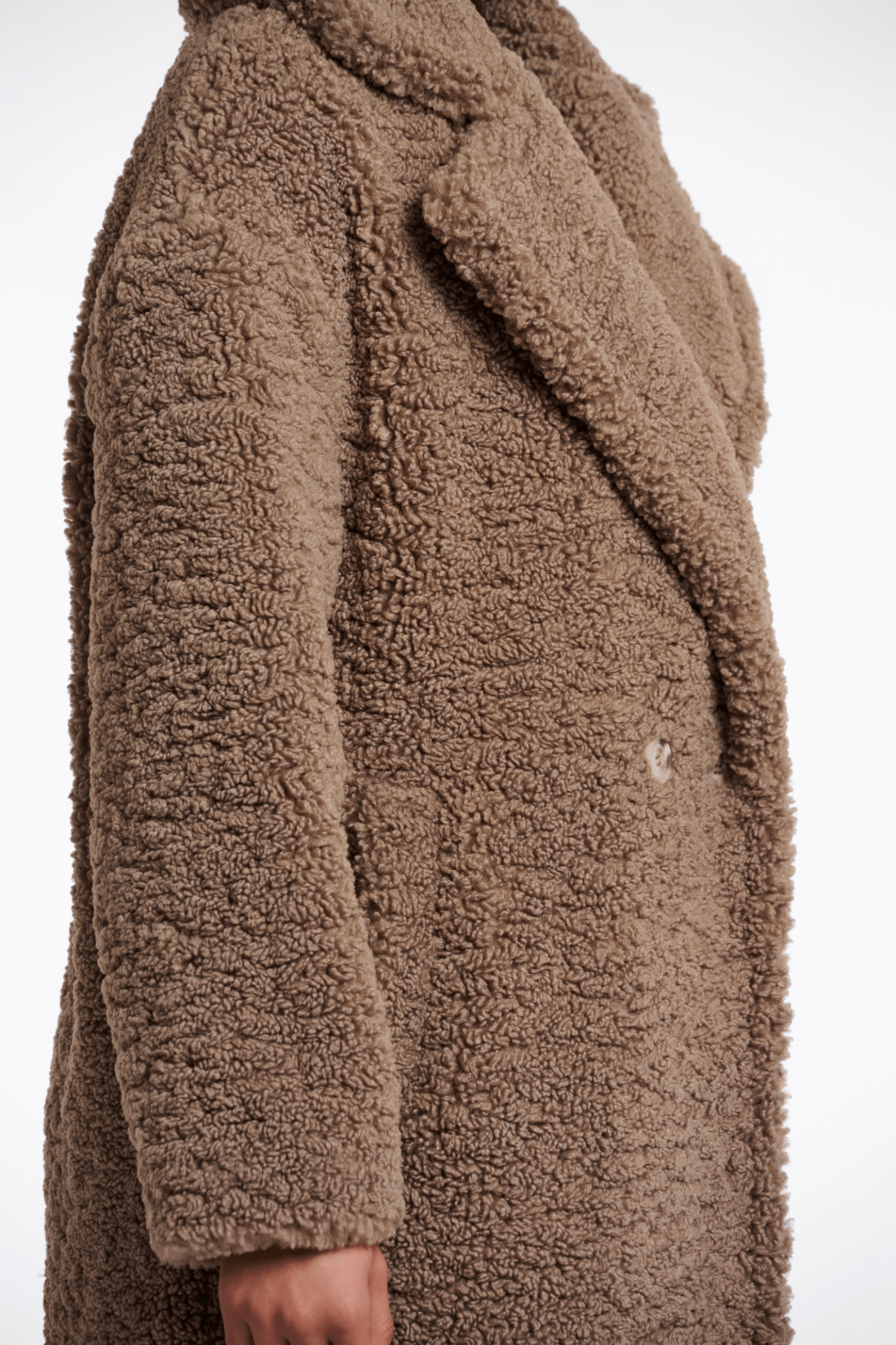 Brown teddy coat on a white background