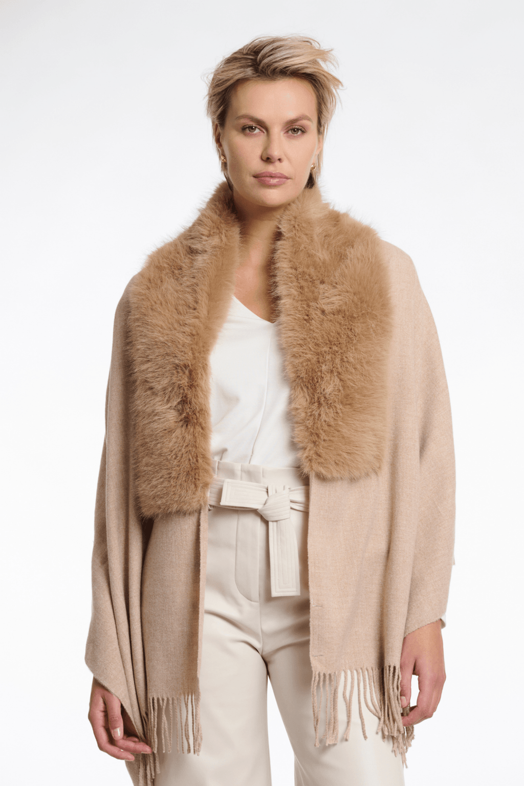 Woman wearing a beige scarf with fur trim on a white background