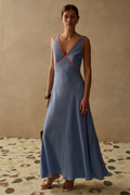 Elegant Pacific Blue dress by Sancia with soft waist shaping and flowing skirt. Lightweight cupro for effortless summer dressing. Shop at Dotique.