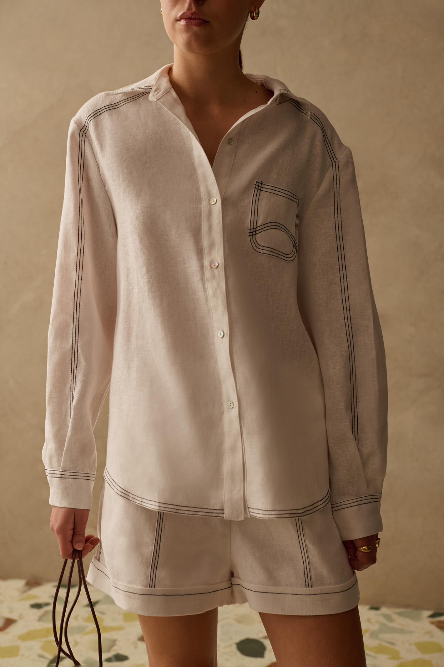 Ivory shirt by Sancia with contrast stitching and a relaxed fit. Lightweight, easy to wear and perfect for everyday styling. Shop now at Dotique.