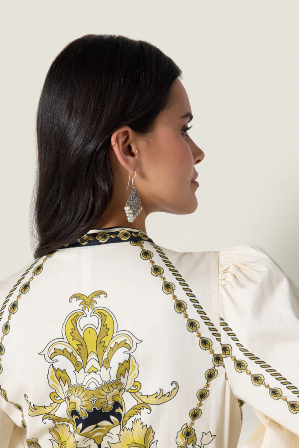 Back view of a woman wearing Scarlett Poppies Baroqueen Floral Dress Papyrus/Burnished Gold by Scarlett Poppies, shop at Dotique
