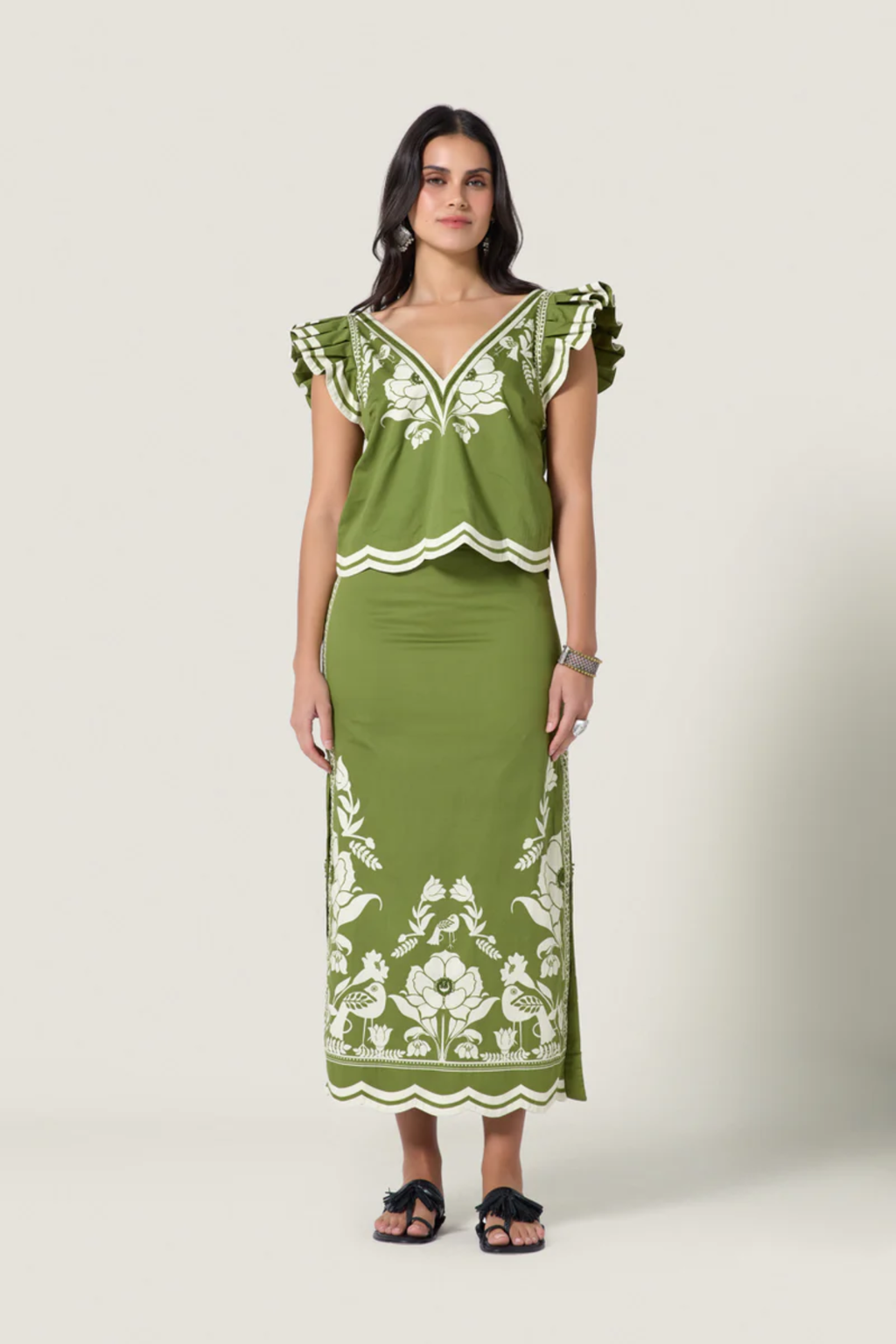 Young woman wearing Scarlett Poppies Sandina Skirt Calla Green/Papyrus by Scarlett Poppies, shop at Dotique.