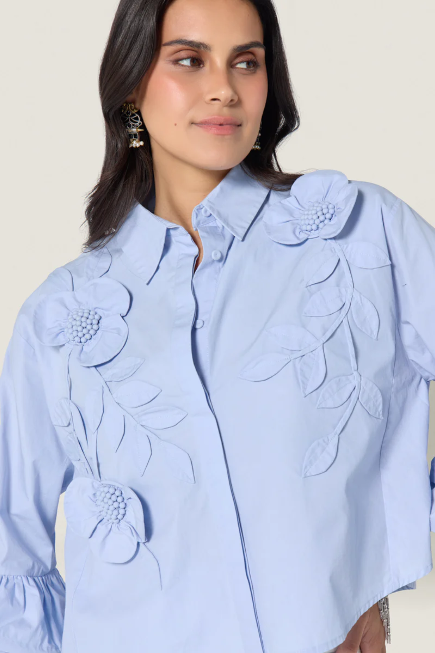 Woman wearing Scarlett Poppies Siena Top Windsurfer Blue with floral details, shop Scarlett Poppies at Dotique.