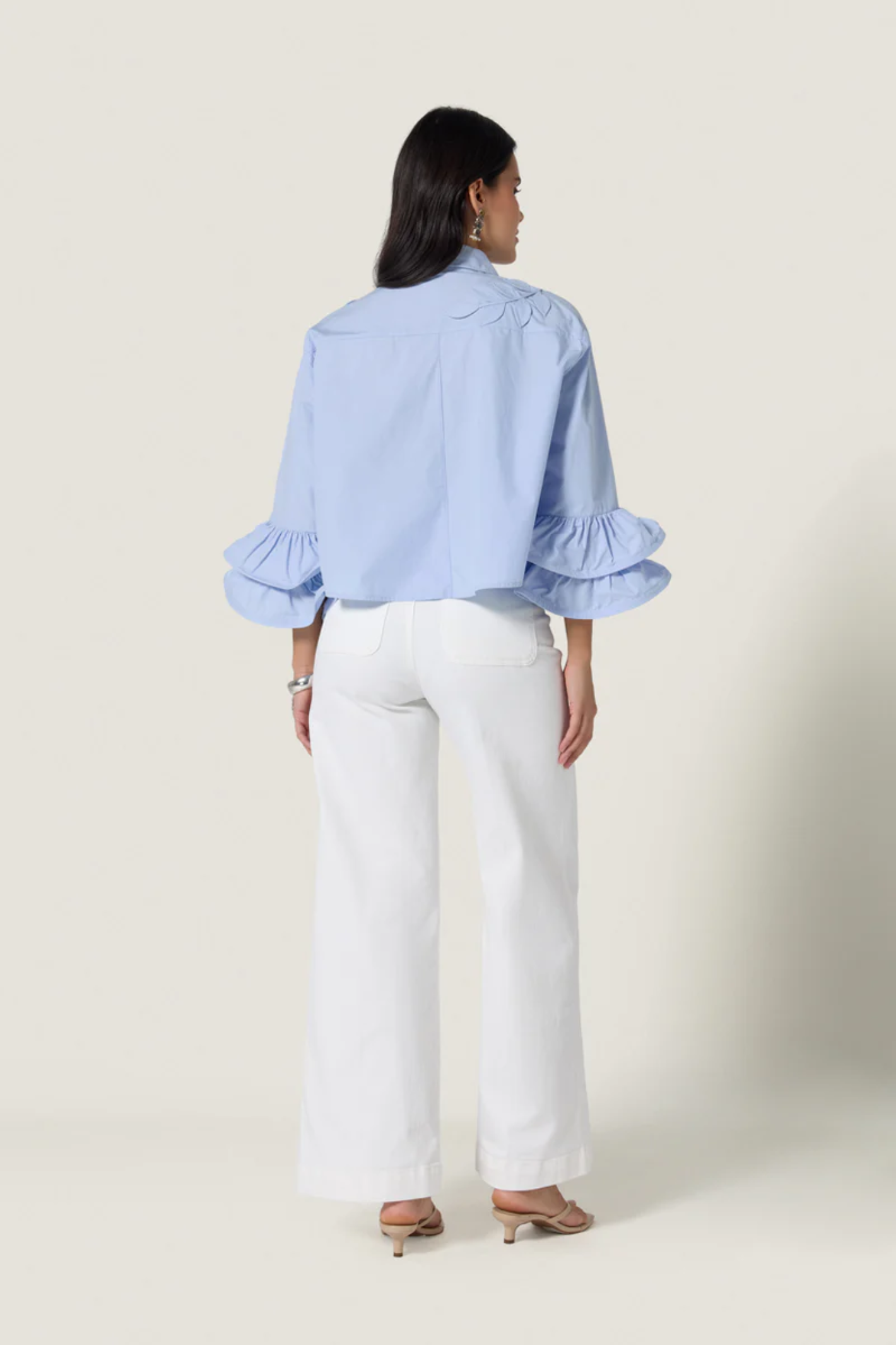 Woman wearing Scarlett Poppies Siena Top Windsurfer Blue with ruffled sleeves, shop Scarlett Poppies at Dotique.