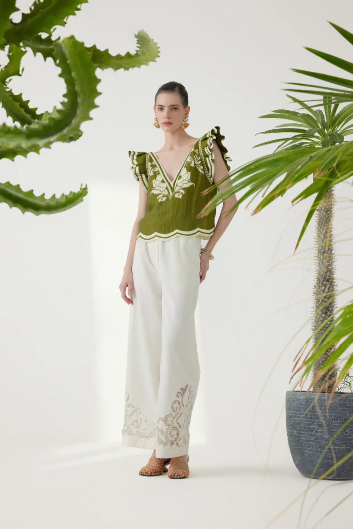 Model wearing Scarlett Poppies Vittore Top Calla Green/Papyrus by Scarlett Poppies, shop Scarlett Poppies at Dotique.