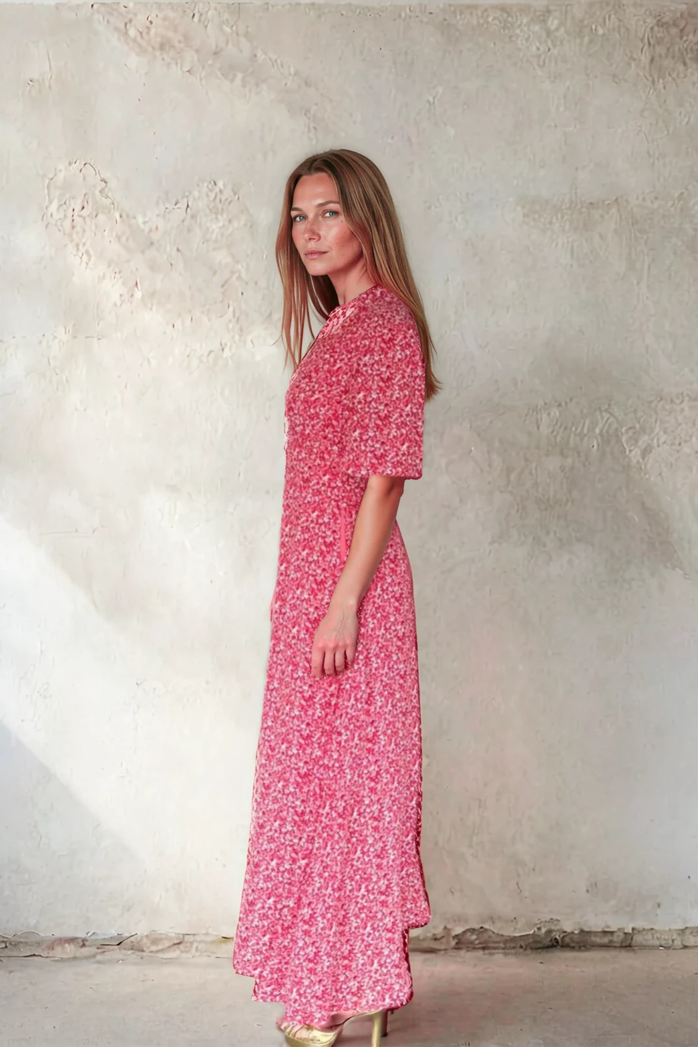 Side view of a woman wearing Sirens Elena Red Ditsy Print Dress with short sleeves and flowing silhouette by Sirens. Shop Sirens at Dotique.