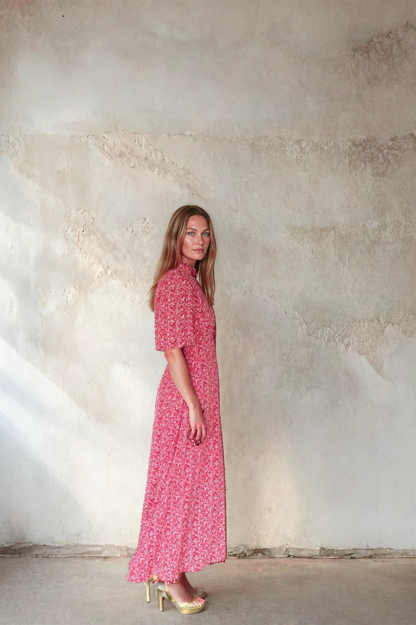 Side profile of a woman wearing Sirens Elena Red Ditsy Print Dress with short sleeves and a flowing hem by Sirens. Shop Sirens at Dotique.