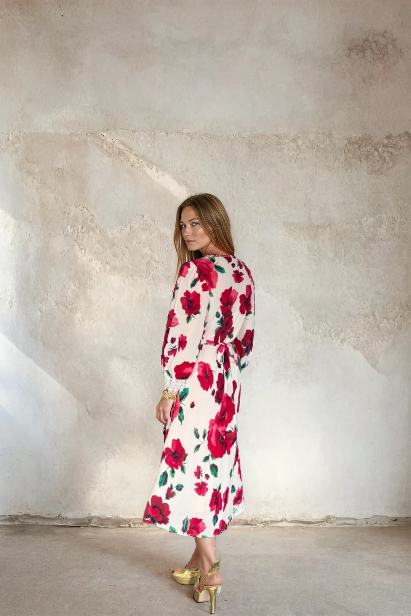 Model showcasing Sirens Violet Cream Poppy Dress with large red floral print and long sleeves by Sirens. Shop Sirens at Dotique.