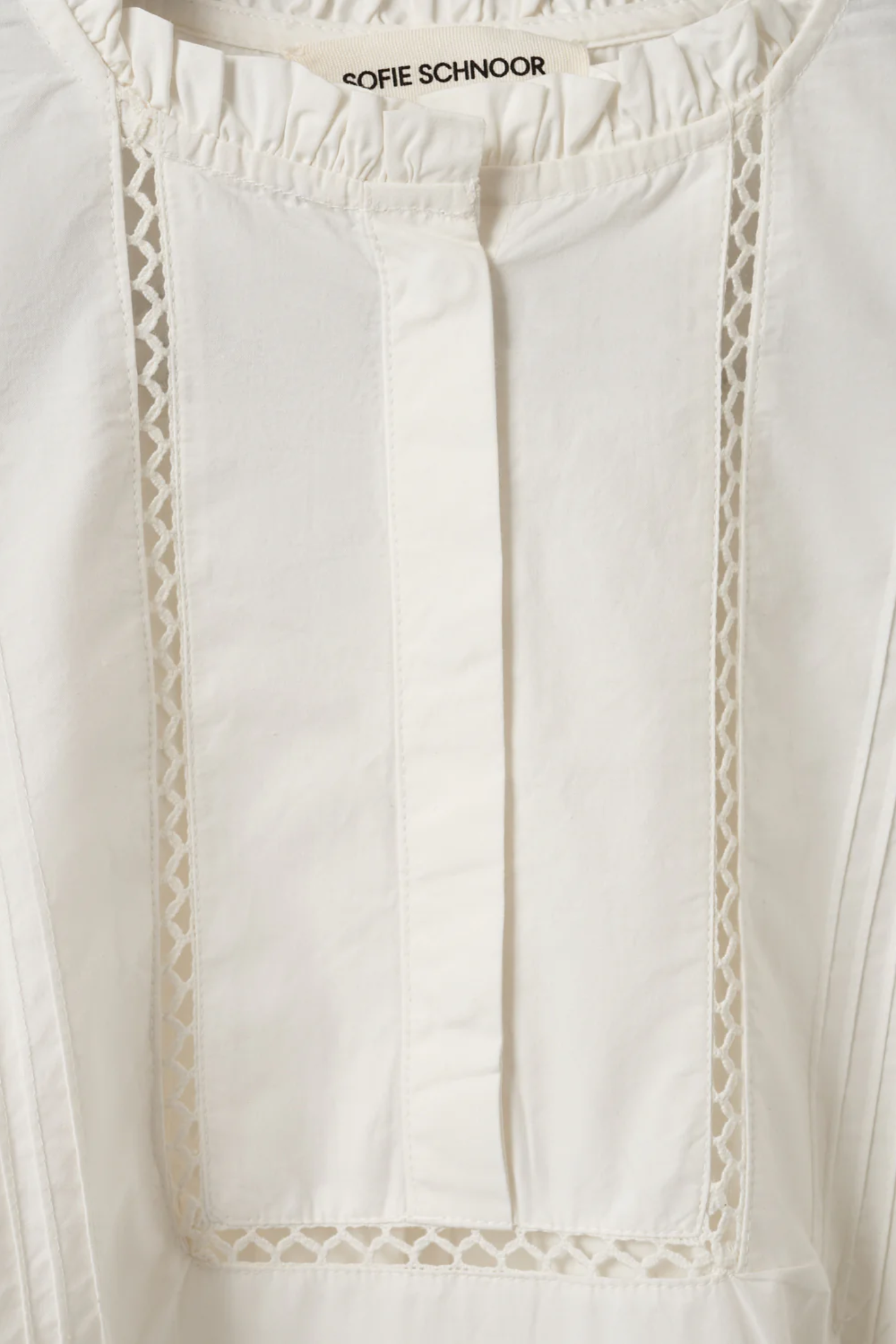 Close-up of white Sofie Schnoor Otaniasw Frill Cotton Dress S262147 with delicate lace trim, shop Sofie Schnoor at Dotique.