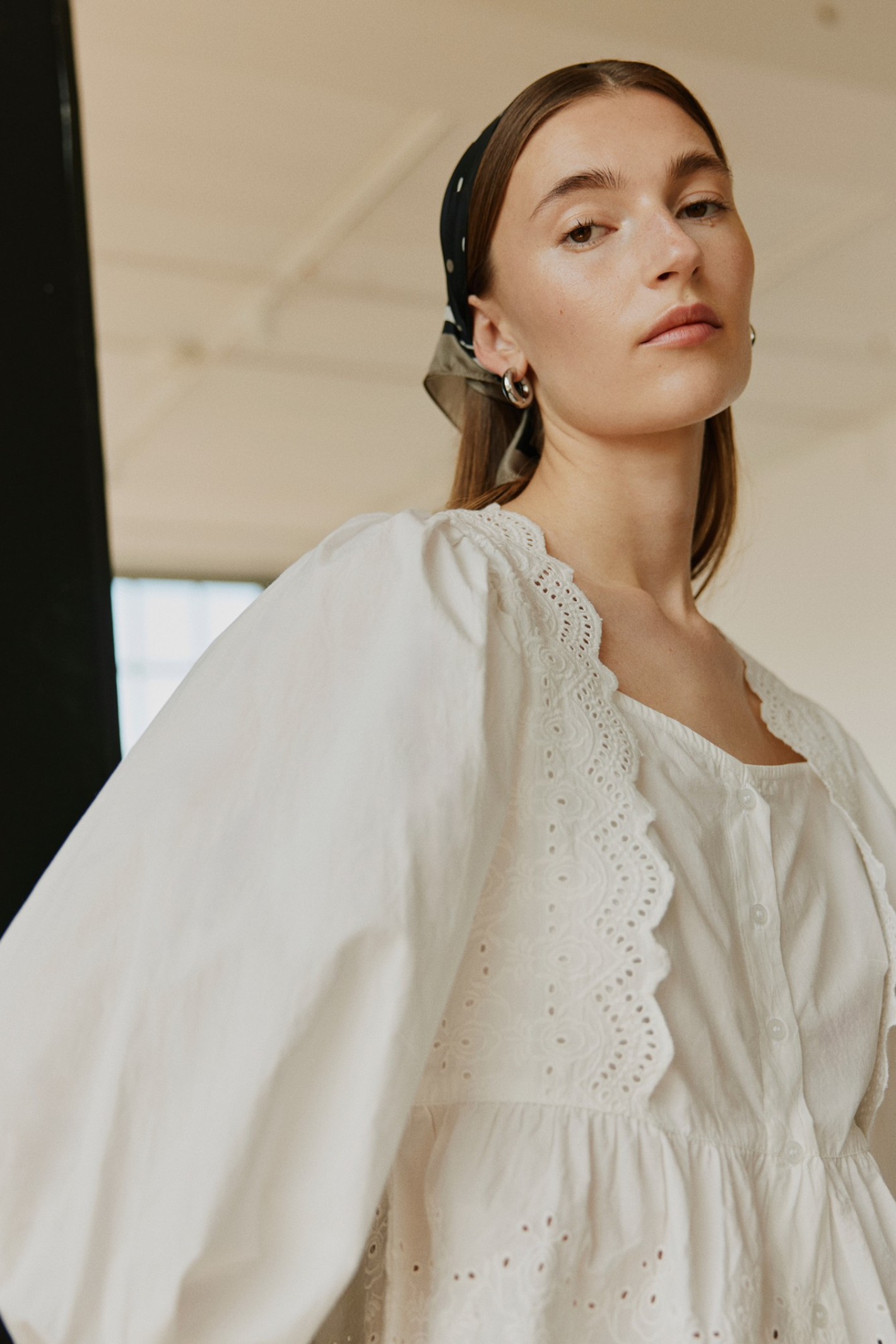 Model wearing Sofie Schnoor S261185 Ariasw Broderie Anglaise Shirt – Off White, shop Sofie Schnoor at Dotique gallery 1