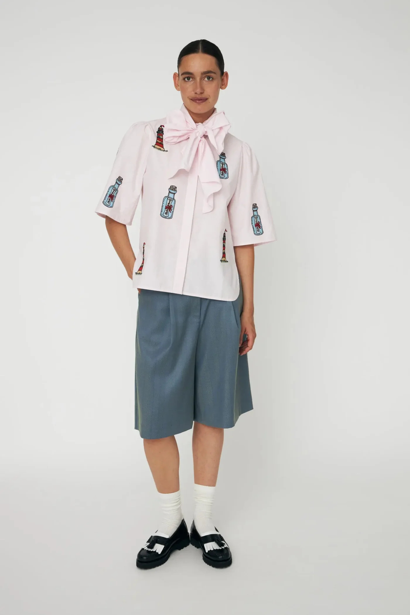 Model wearing Stella Nova Embroidered Bow Shirt Pale Pink with embroidered details from Stella Nova shop at Dotique gallery 1