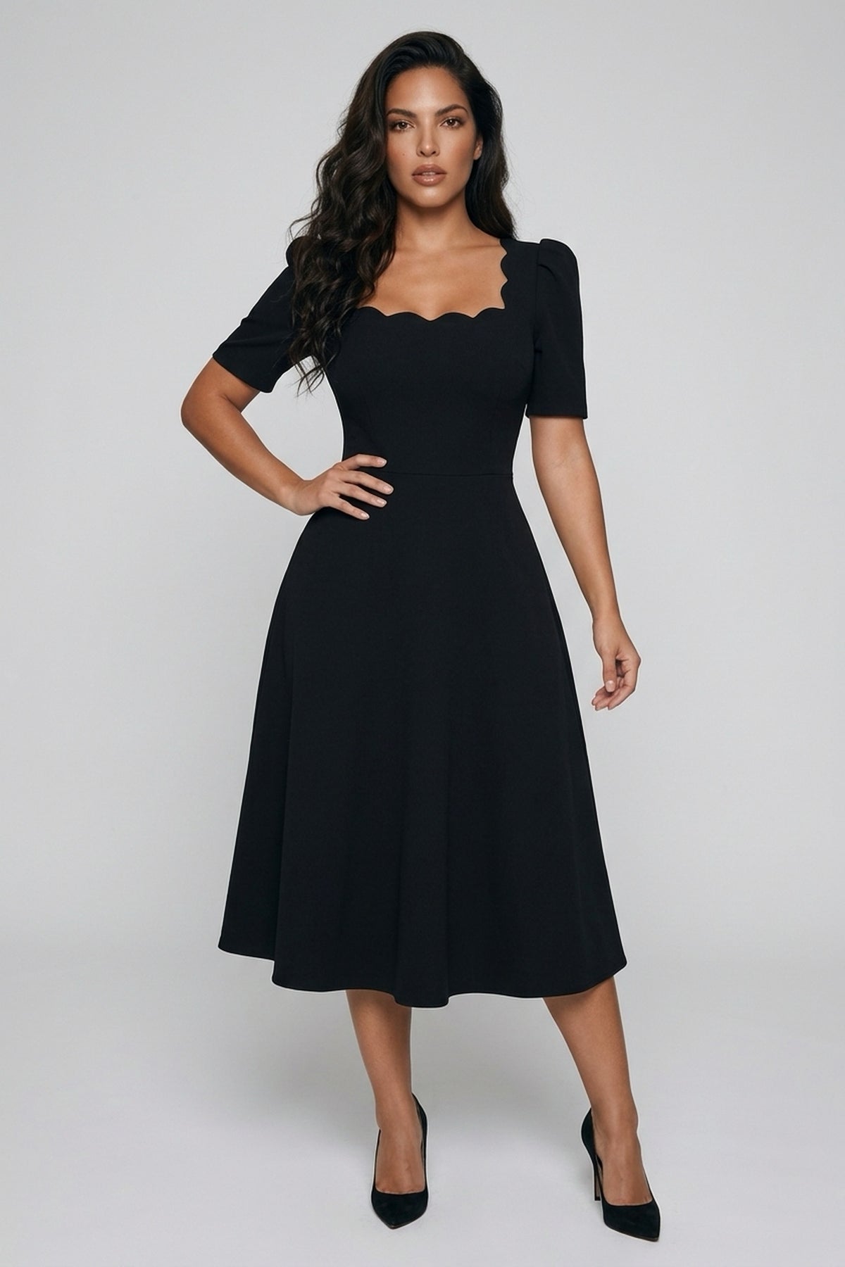 Front view of a model wearing The 8th Sign Livia scallop midi dress in black