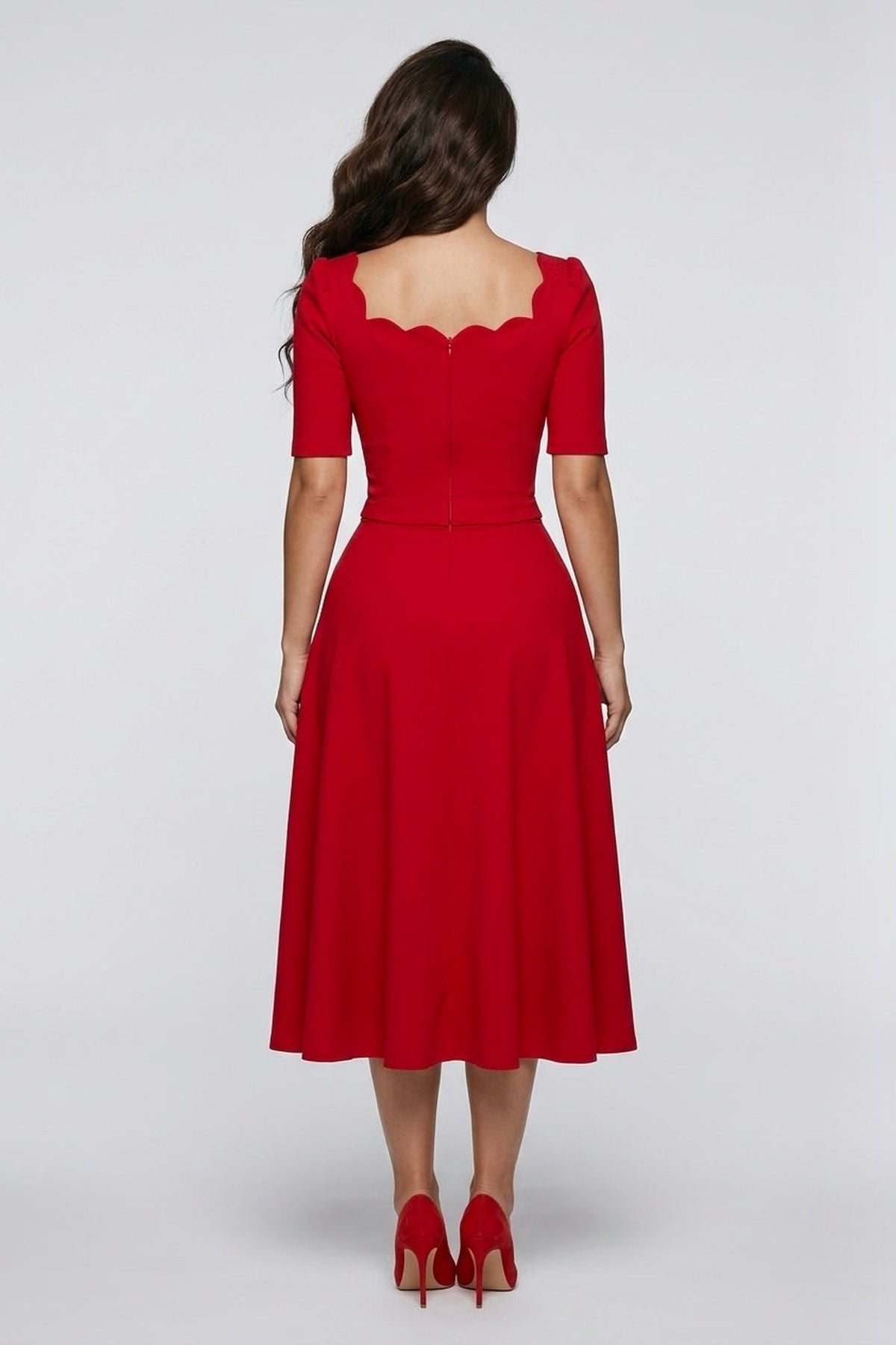 Back view of a model wearing The 8th Sign Livia scallop midi dress in red