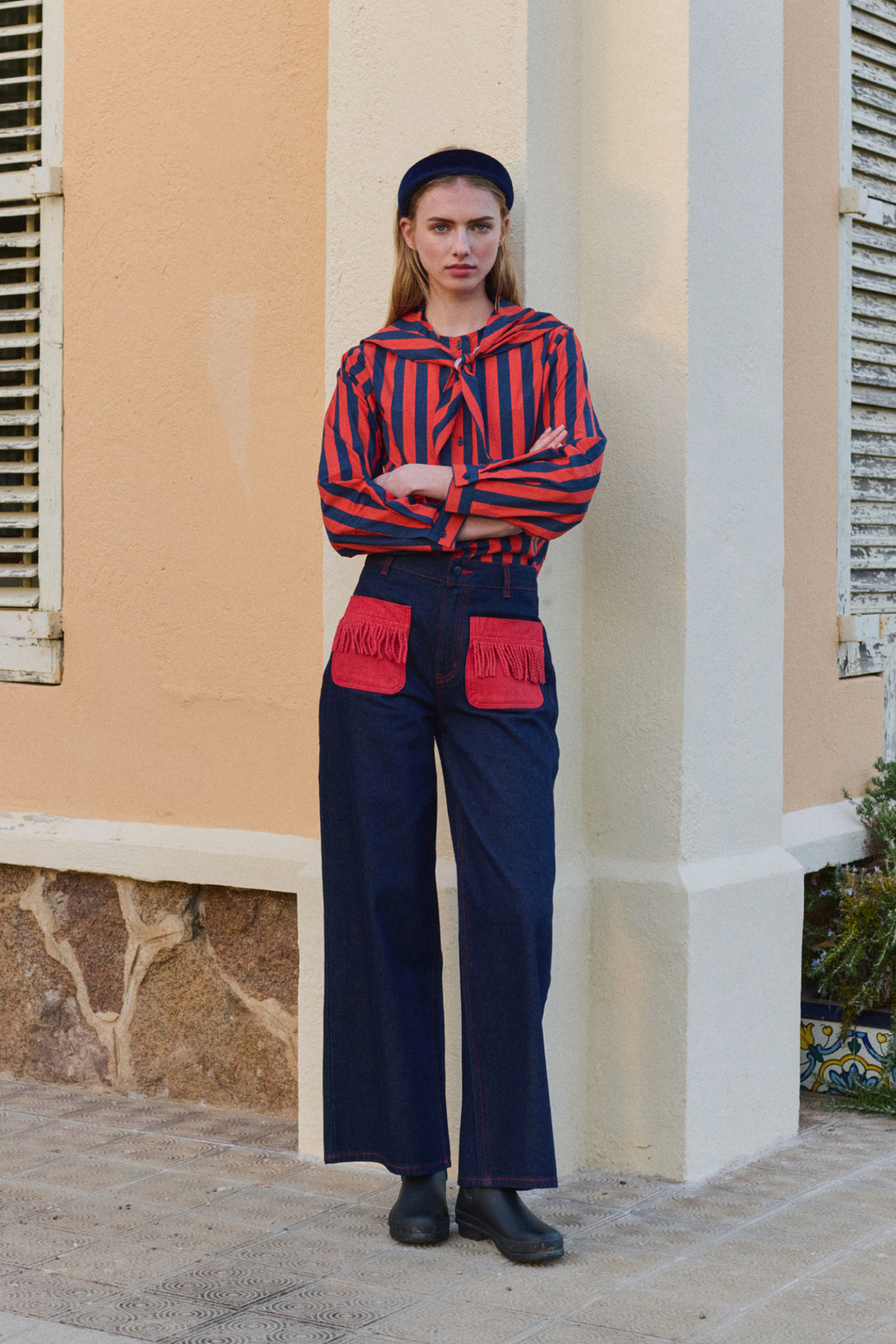 Shop The Tiny Big Sister wide-leg denim trousers in indigo with contrast red fringed pockets. 100% Cotton statement denim at Dotique.