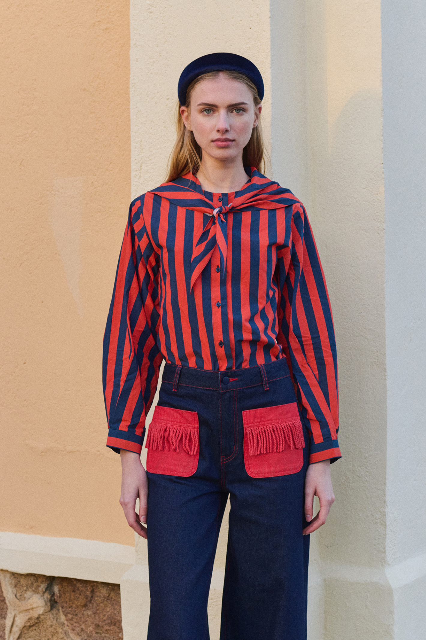 Shop The Tiny Big Sister wide-leg denim trousers in indigo with contrast red fringed pockets. 100% Cotton statement denim at Dotique.