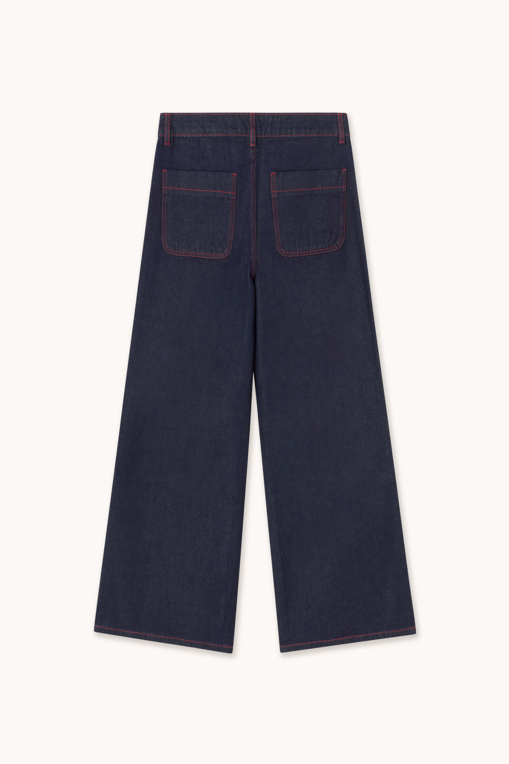 Shop The Tiny Big Sister wide-leg denim trousers in indigo with contrast red fringed pockets. 100% Cotton statement denim at Dotique.