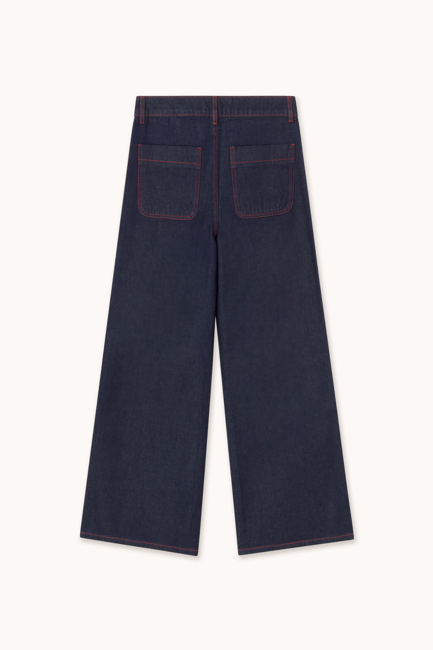 Shop The Tiny Big Sister wide-leg denim trousers in indigo with contrast red fringed pockets. 100% Cotton statement denim at Dotique.