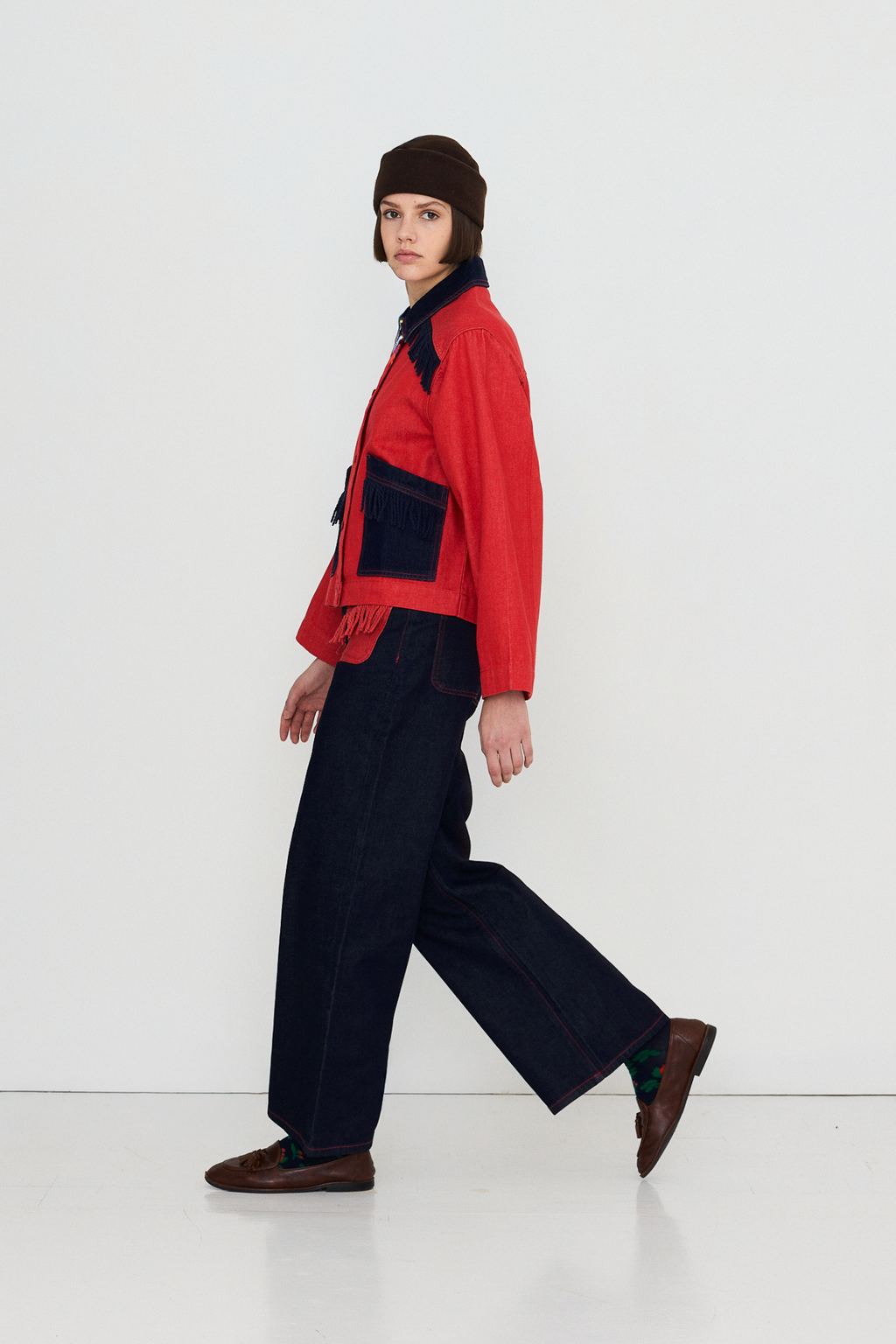 Shop The Tiny Big Sister wide-leg denim trousers in indigo with contrast red fringed pockets. 100% Cotton statement denim at Dotique.