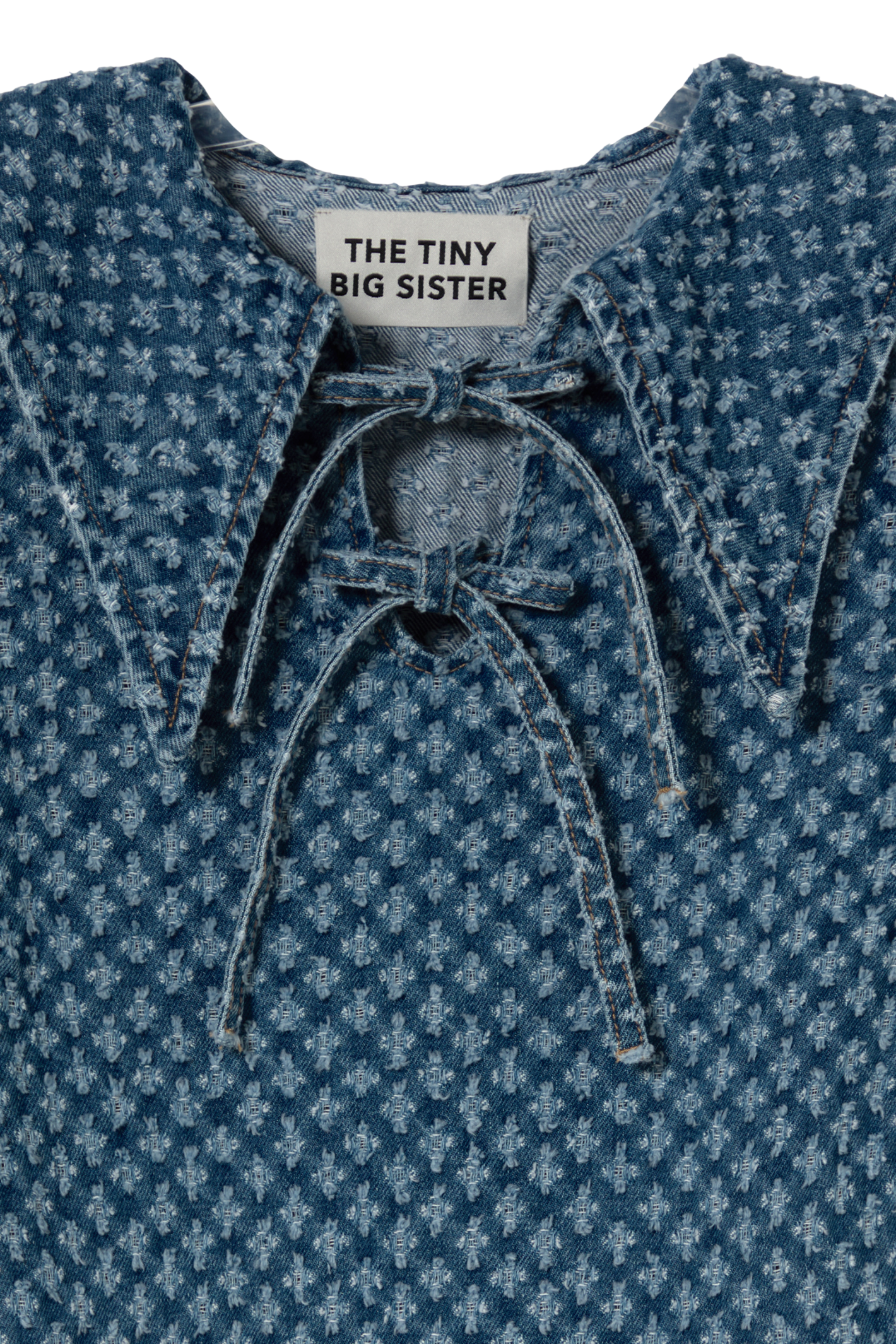 Tiny Big Sister puff sleeve denim dress in soft 100% cotton. A flattering, easy-to-wear summer style. Shop at Dotique.