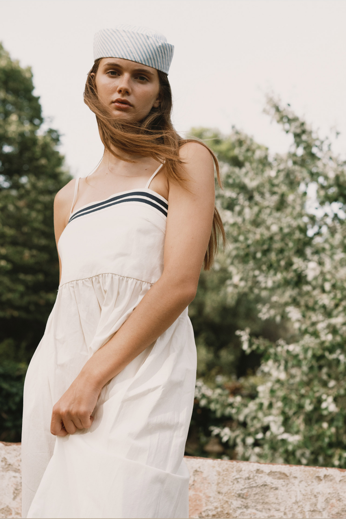 Tiny Big Sister strappy dress in a breathable cotton, viscose and linen blend. Light, flattering and perfect for summer. Shop at Dotique.