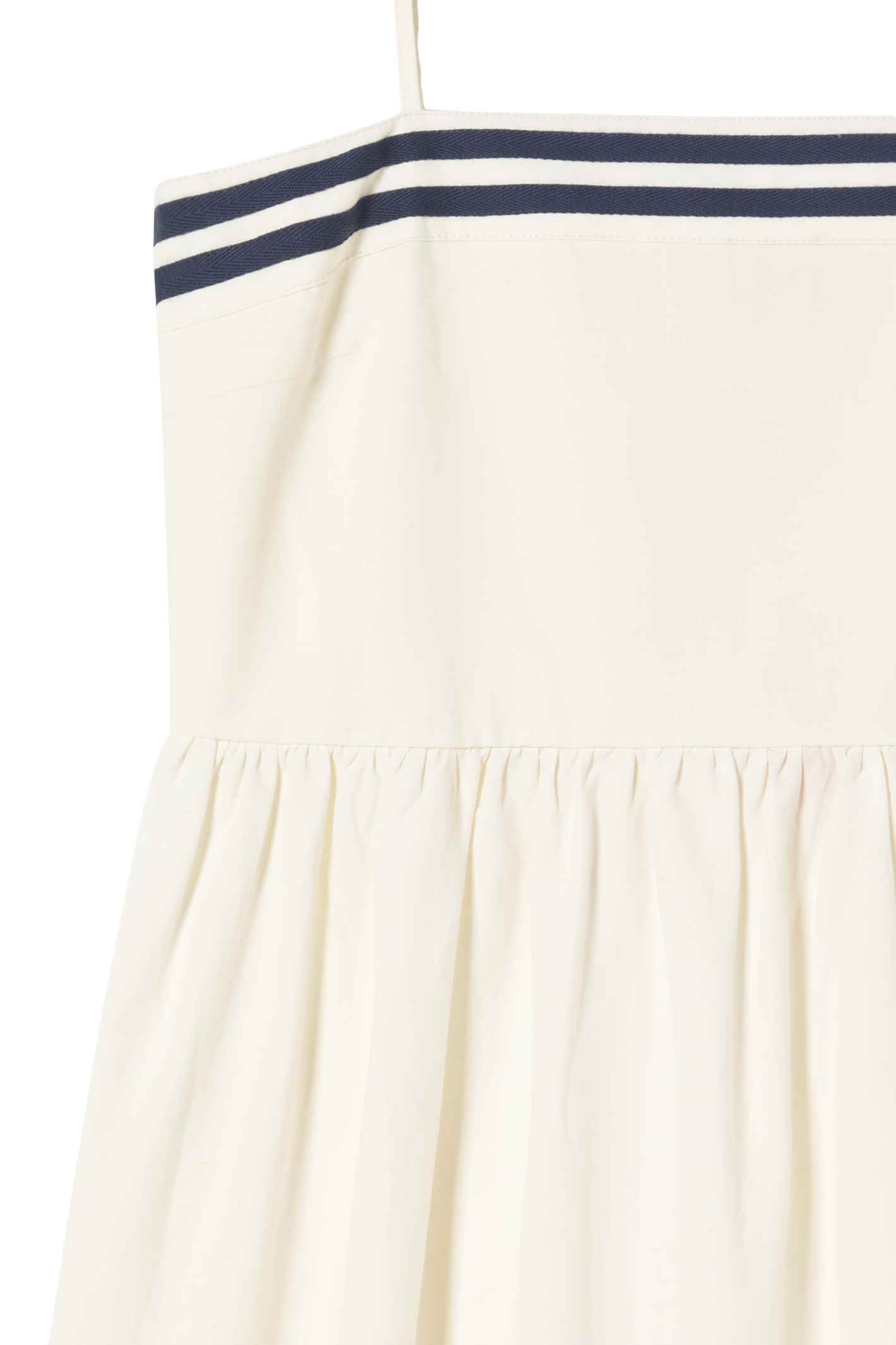 Tiny Big Sister strappy dress in a breathable cotton, viscose and linen blend. Light, flattering and perfect for summer. Shop at Dotique.