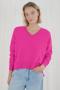 Add a pop of colour with the TWNS The Label Boulder Neon Pink V-Neck Jumper. Crafted from a luxuriously soft raccoon blend with a relaxed fit and flattering V-neck. Shop TWNS The Label  at Dotique.