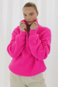 TWNS The Label Breckenridge neon pink trucker neck jumper with zip neckline and relaxed fit. Shop TWNS The Label at Dotique.