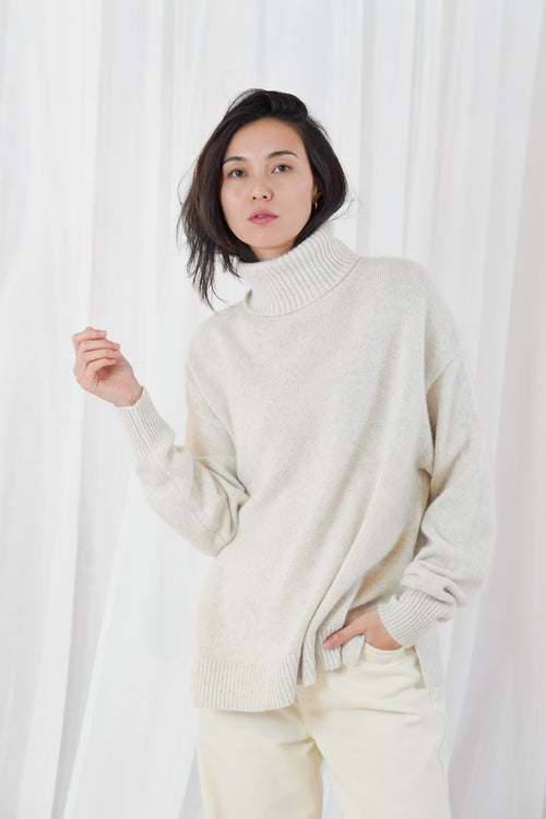 TWNS The Label Greeley mottled beige turtleneck jumper with a relaxed fit and long sleeves.