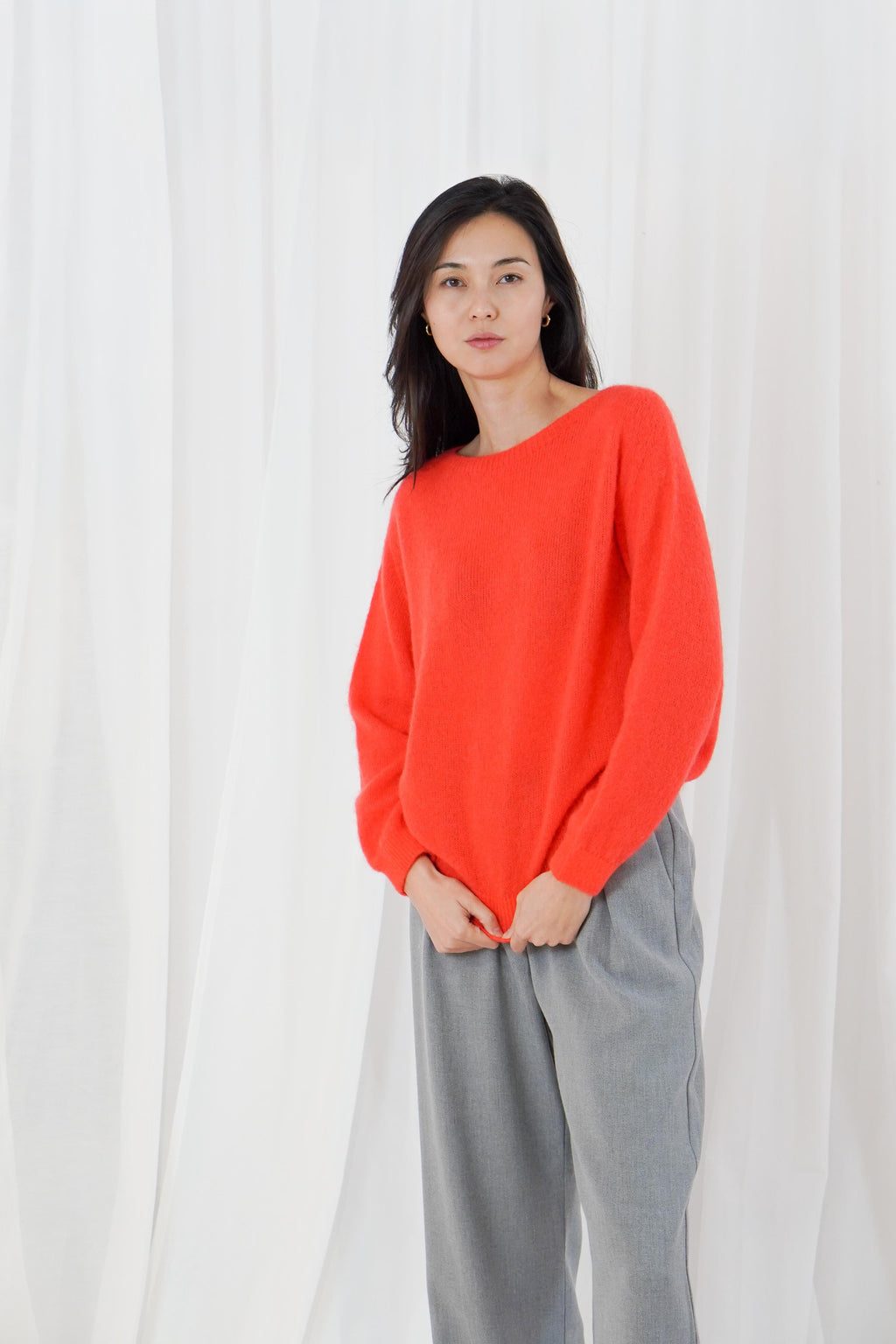 TWNS The Label Sanibel Fire boat neck jumper in a vibrant coral-red with a relaxed fit and long sleeves.