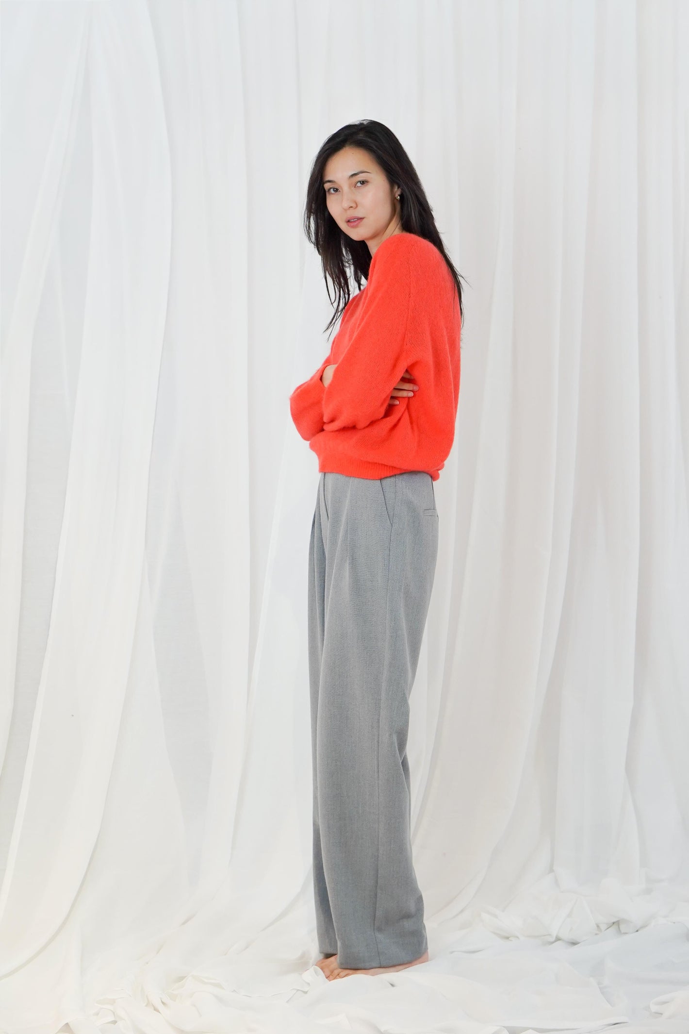 TWNS The Label Sanibel Fire boat neck jumper in a vibrant coral-red with a relaxed fit and long sleeves.
