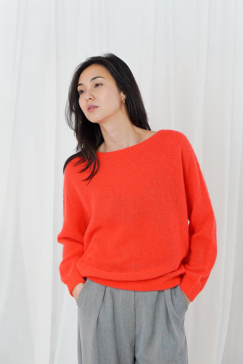 TWNS The Label Sanibel Fire boat neck jumper in a vibrant coral-red with a relaxed fit and long sleeves.
