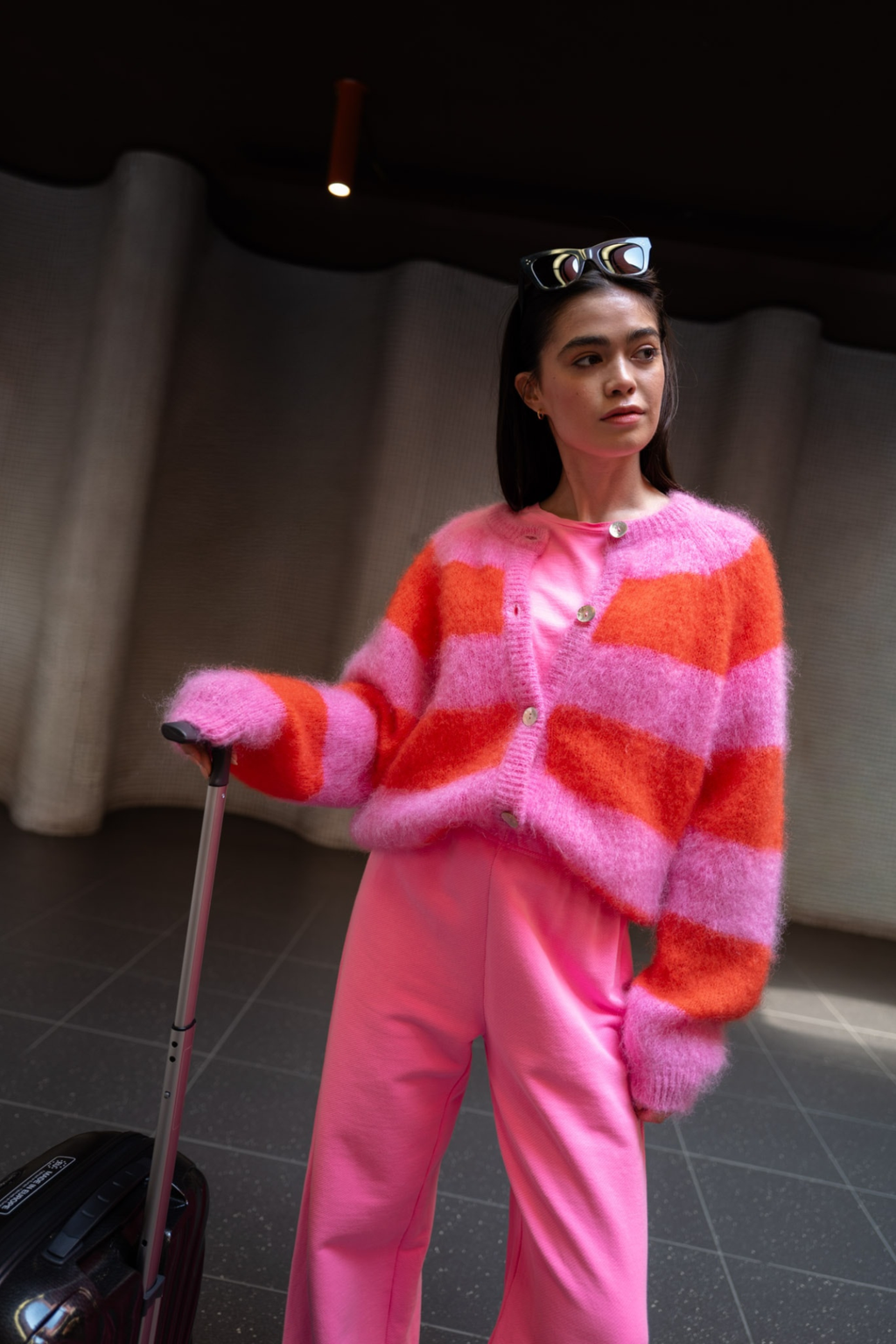 TWNS The Label Timea bubblegum pink and fire striped cardigan with a round neck, button front and relaxed fit.