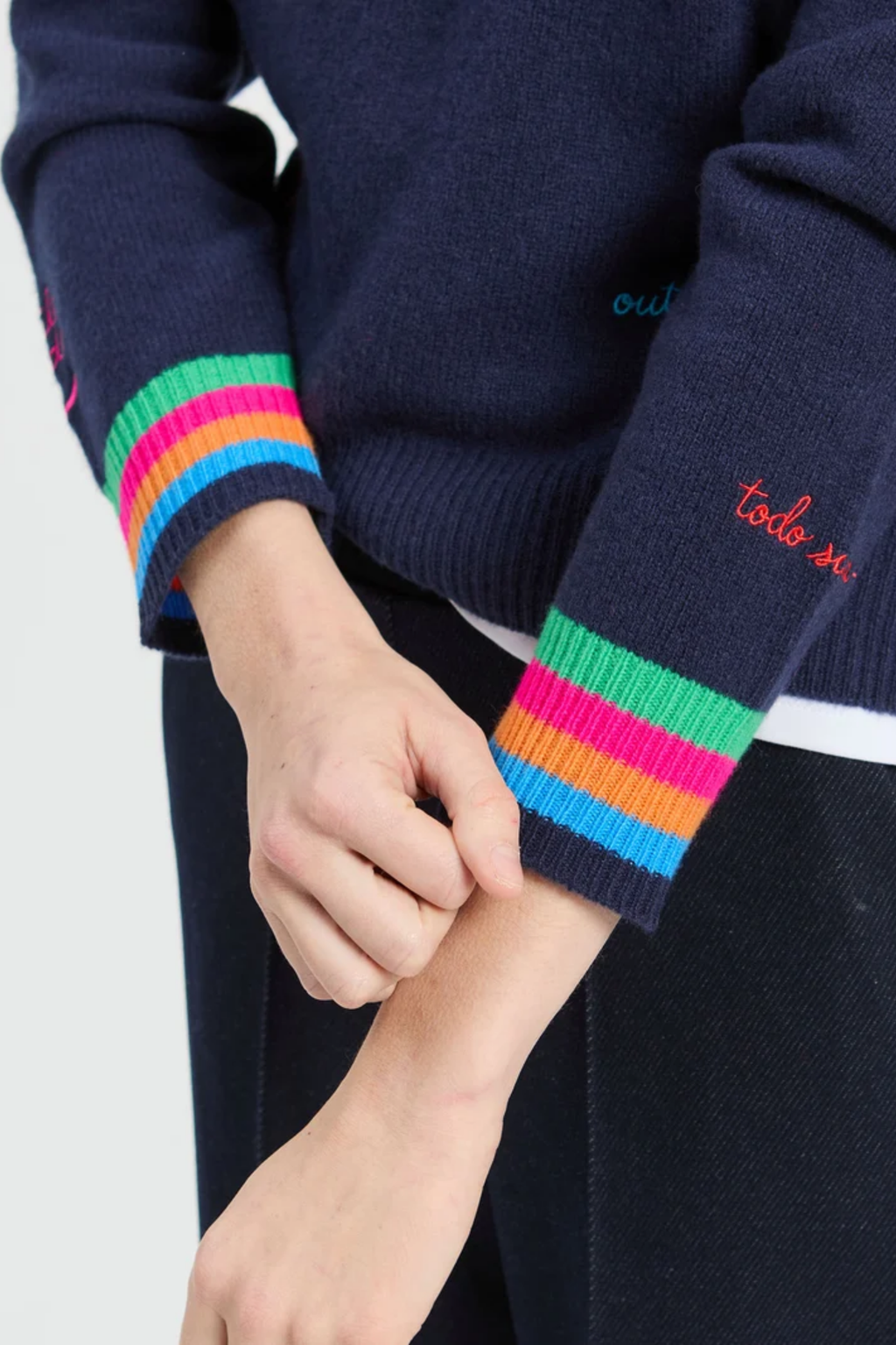 Vilagallo 34126 Navy Embroidered Words Lambswool Jumper with rainbow cuffs Shop Vilagallo at Dotique