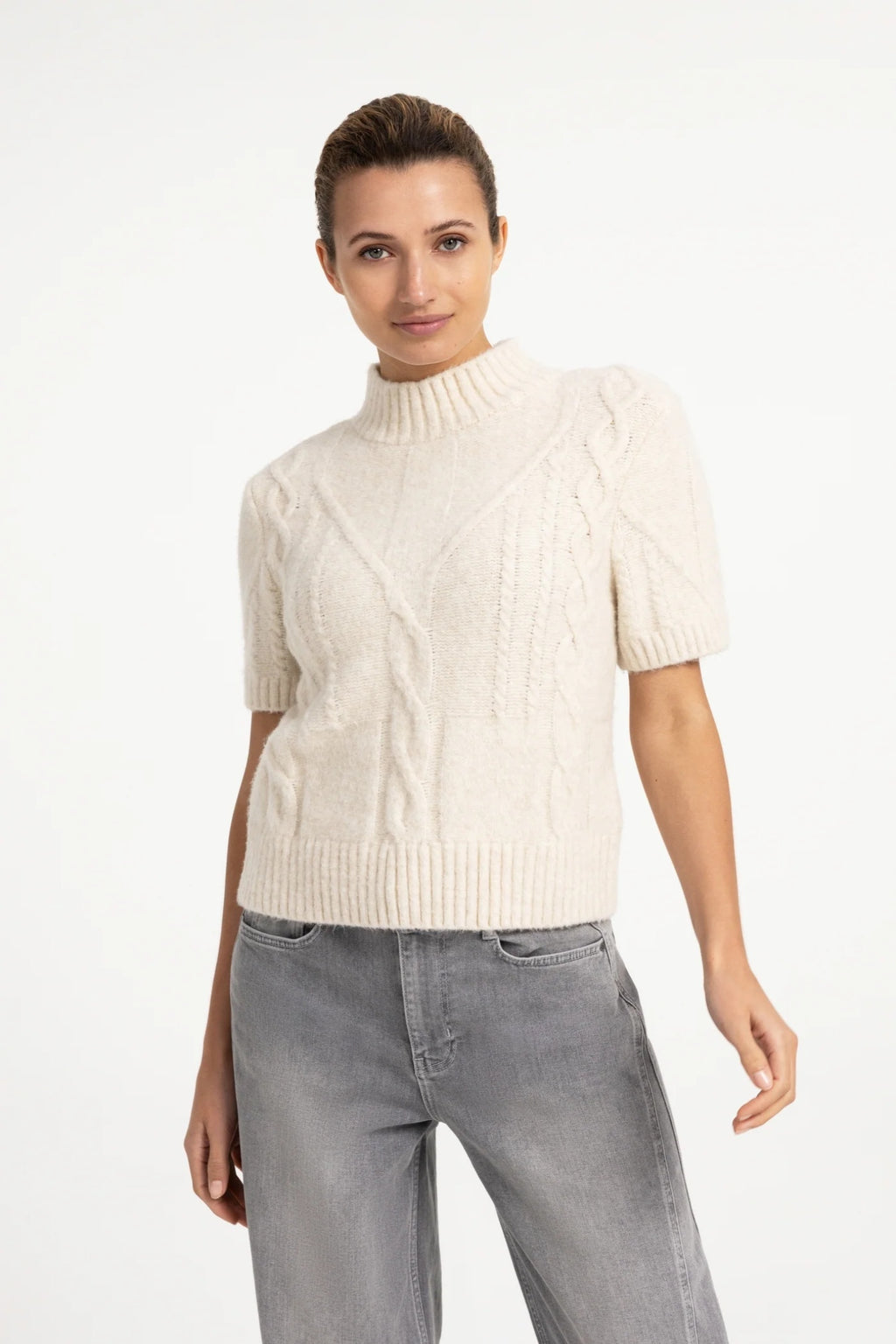 Shop the YAYA Cable Knit Short Sleeve Jumper in Off White Melange at Dotique. A textured cable knit with a mock neck, short sleeves and a regular fit.