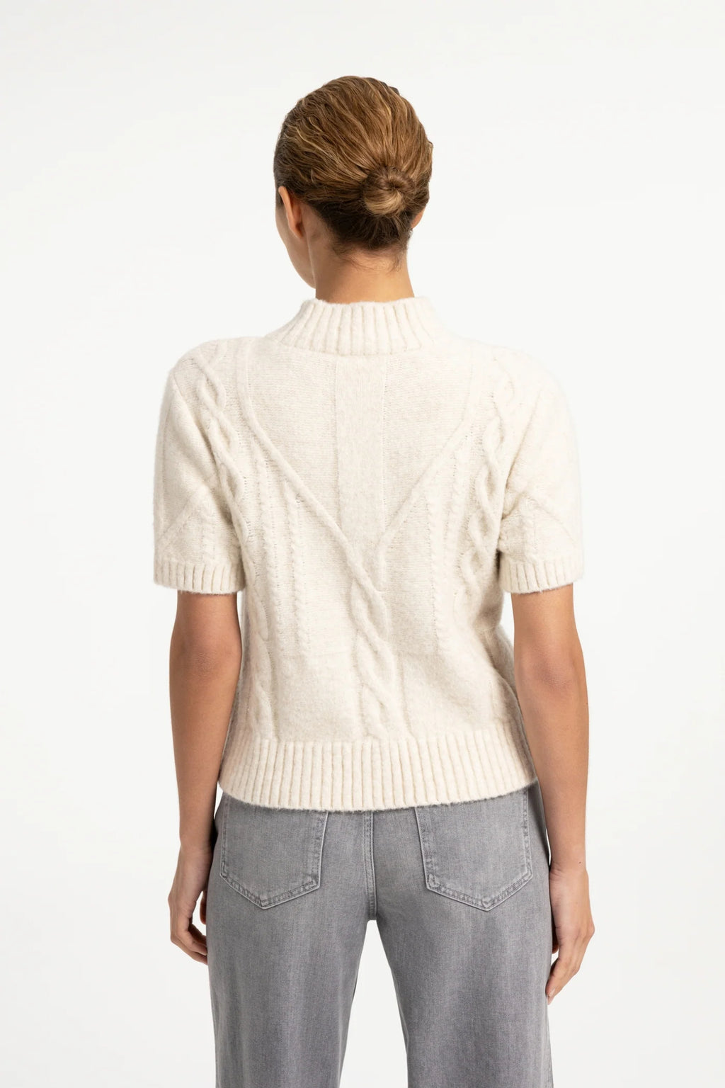 Shop the YAYA Cable Knit Short Sleeve Jumper in Off White Melange at Dotique. A textured cable knit with a mock neck, short sleeves and a regular fit.