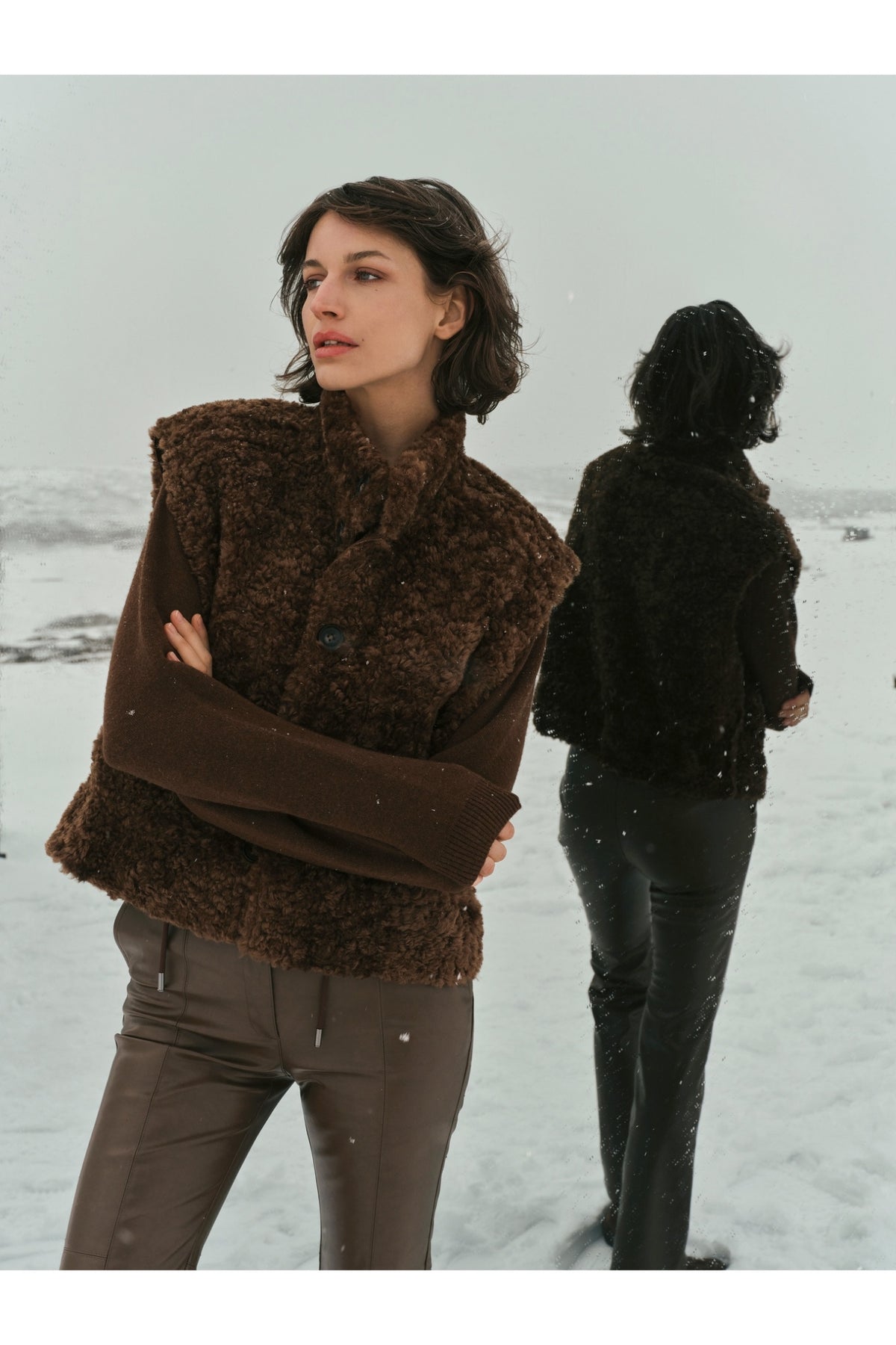Yaya 02-029012-610 Reversible Gilet Suede and Fur Cocoa Brown worn in snow. Shop YAYA at Dotique