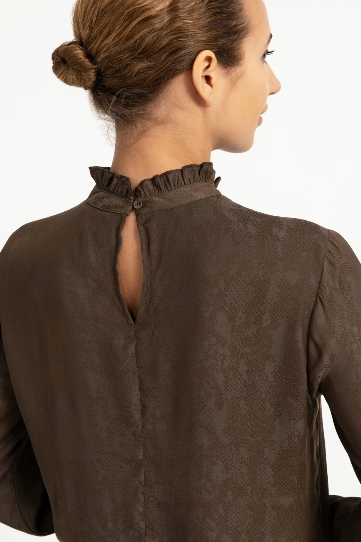 Shop YAYA’s Long Sleeve Top with Ruffle Details in Slate Black Brown Dessin at Dotique. A textured top with delicate neckline and cuff ruffles.